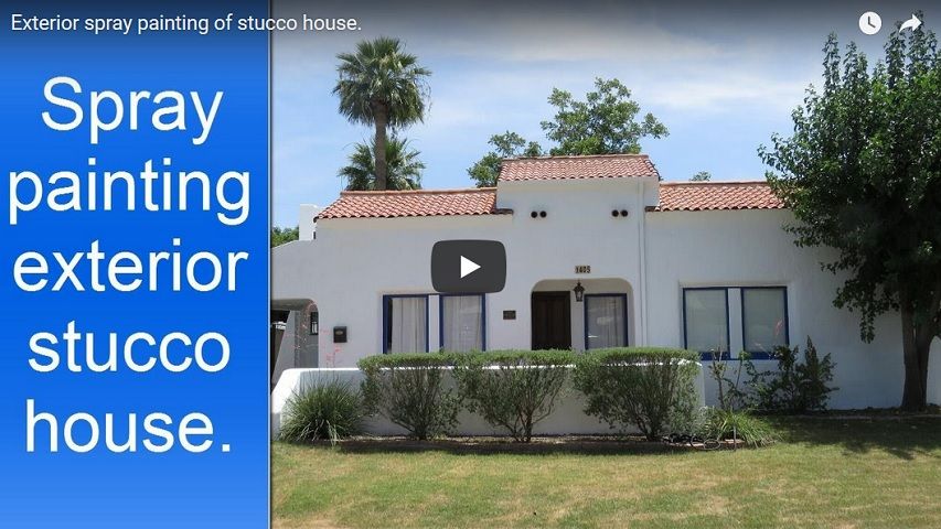  Spray painting a house exterior stucco and wood trim