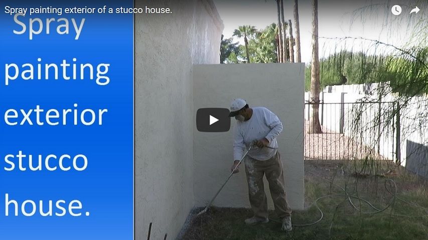  Spray painting exterior of a stucco house