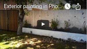 Painting exterior house with stucco wall.